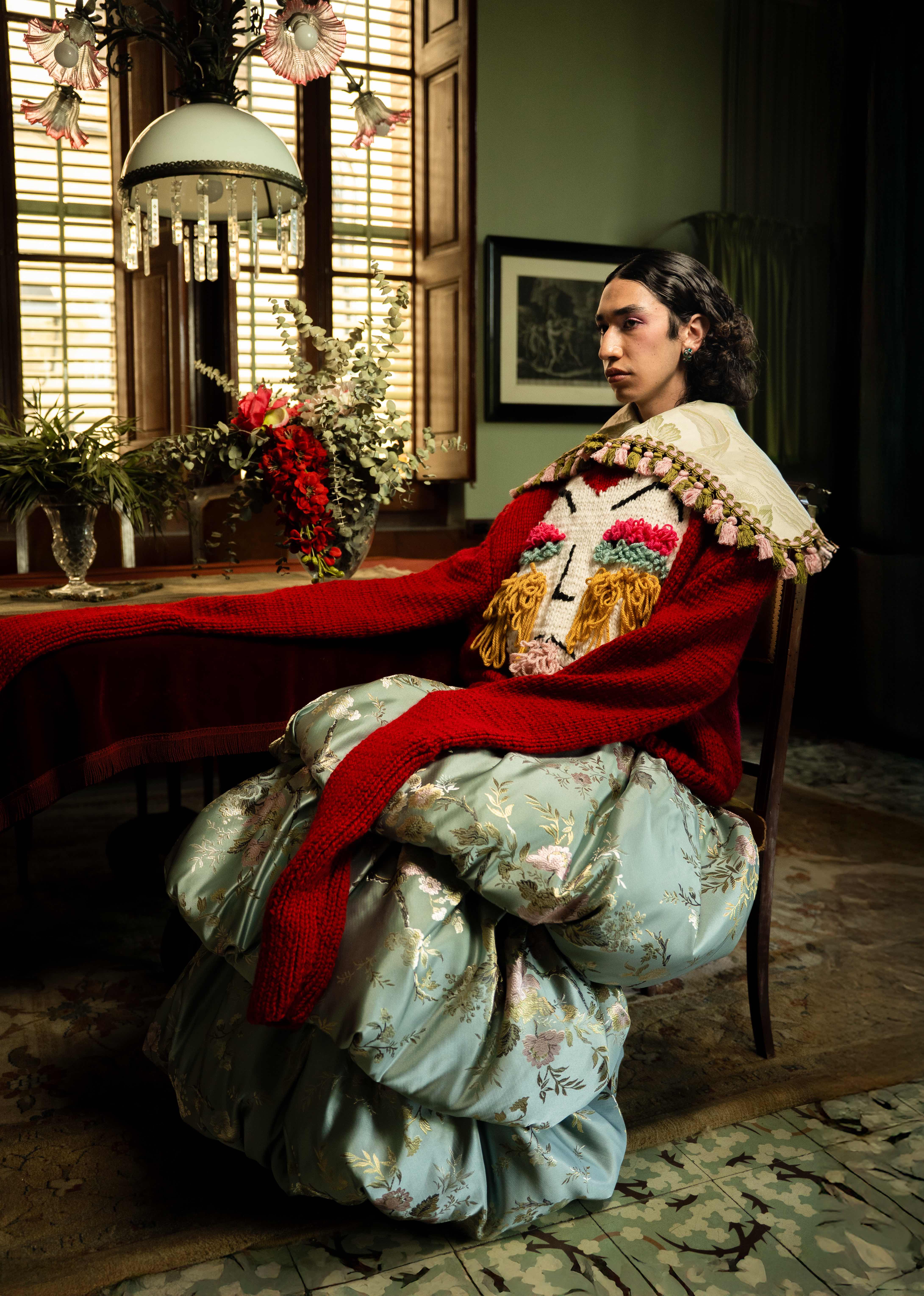 Puppet Riot FW25 Editorial - Model in red knit sweater and brocade skirt