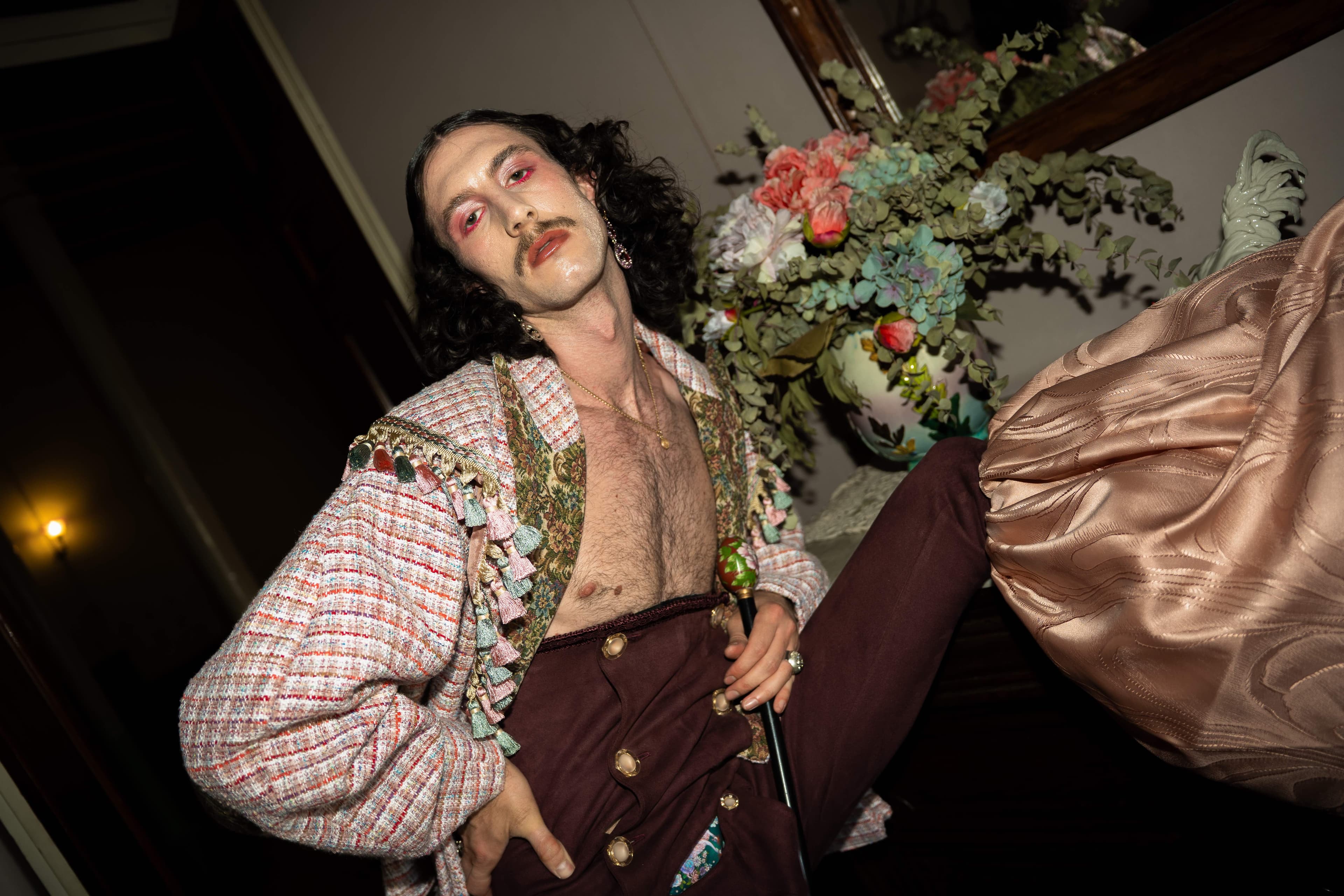 Mona Puppet Riot FW25 — low angle editorial shot, upholstery tweed jacket Mariona Ramos