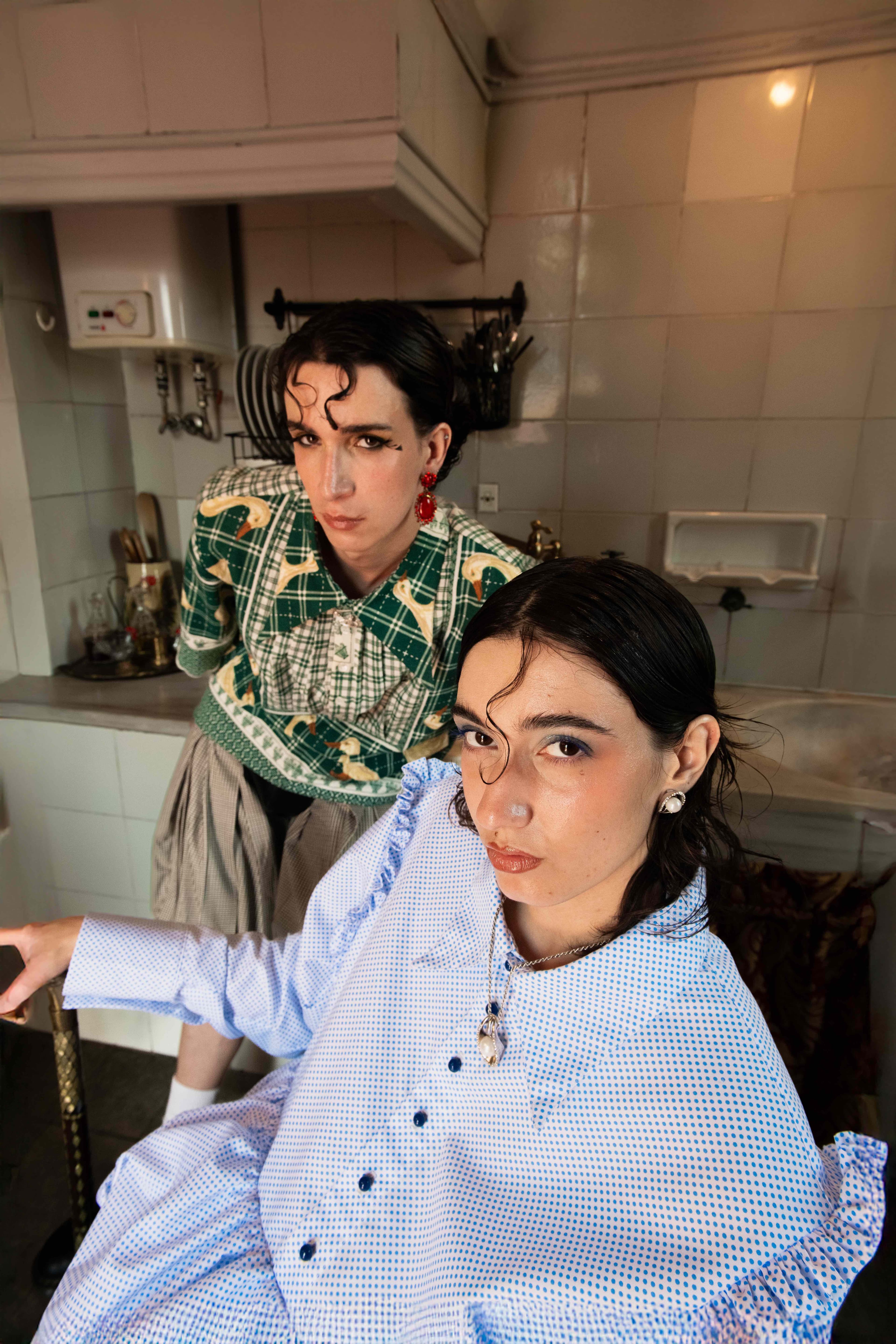 Mona Puppet Riot FW25 — two models in maximalist fashion editorial, domestic textile collection